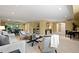 Spacious living room area with dining area, modern decor, and great light at 5751 E Ithaca Pl # 3, Denver, CO 80237