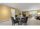 Open floorplan showcasing dining area flowing into living area, excellent for seamless entertaining at 5751 E Ithaca Pl # 3, Denver, CO 80237