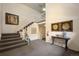 Welcoming lobby area with a staircase, decorative art, and a cozy ambiance at 5751 E Ithaca Pl # 3, Denver, CO 80237