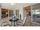 This patio area provides a nice transition to an airy bedroom and dining room through sliding glass doors at 5751 E Ithaca Pl # 3, Denver, CO 80237