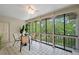 Cozy sunroom with views of lush greenery, perfect for relaxing and entertaining guests at 5751 E Ithaca Pl # 3, Denver, CO 80237