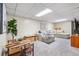 Finished basement featuring plush carpeting, a large sectional sofa, and stylish decor at 7034 S Cherry St, Centennial, CO 80122