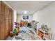 Finished basement space featuring storage, a play area, and colorful decor at 7034 S Cherry St, Centennial, CO 80122