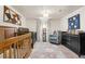 Shared Bedroom with two cribs, a dresser, and a comfortable rocker at 7034 S Cherry St, Centennial, CO 80122