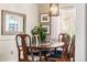 Formal dining area featuring a wooden table, upholstered chairs, and decorative elements at 7034 S Cherry St, Centennial, CO 80122