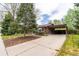 Charming brick home with a long driveway and a carport offering curb appeal at 7034 S Cherry St, Centennial, CO 80122
