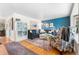 Cozy living room with hardwood floors, stylish decor, and comfortable seating arrangement at 7034 S Cherry St, Centennial, CO 80122