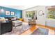 Inviting living room with natural light, a bay window, and chic furniture at 7034 S Cherry St, Centennial, CO 80122