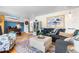Well-decorated living room with vintage charm and a view to a hallway and seating area at 7034 S Cherry St, Centennial, CO 80122