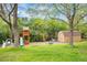 Playground with a playhouse, slide, swing set, climbing structure, and a small shed, offering outdoor fun at 7034 S Cherry St, Centennial, CO 80122