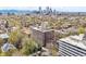 Aerial view of residential buildings with city skyline and mountain views at 1085 N Lafayette St # 702, Denver, CO 80218