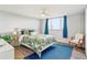 Relaxing bedroom with a stylish bed, bright window, and cozy decor, creating a comfortable retreat at 1085 N Lafayette St # 702, Denver, CO 80218