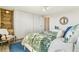 Cozy bedroom with a plush bed, built-in shelving, and tranquil decor, offering a comfortable and organized space at 1085 N Lafayette St # 702, Denver, CO 80218