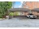Covered carport providing protection for vehicles from the elements, ensuring convenience at 1085 N Lafayette St # 702, Denver, CO 80218