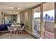Bright dining area with city views and sleek, modern furniture at 1085 N Lafayette St # 702, Denver, CO 80218