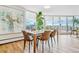 Modern dining room with sleek furniture and a picturesque view, perfect for entertaining at 1085 N Lafayette St # 702, Denver, CO 80218