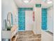 Inviting hallway with tiled floors, patterned wallpaper, and stylish console table, creating a welcoming entrance at 1085 N Lafayette St # 702, Denver, CO 80218