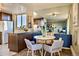 Well-lit kitchen with dark wood cabinets, granite countertops, and modern appliances at 1085 N Lafayette St # 702, Denver, CO 80218