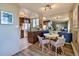 Open-concept kitchen and dining area with wood cabinets and stainless steel appliances at 1085 N Lafayette St # 702, Denver, CO 80218