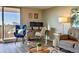 A cozy living room featuring a work space, comfortable furniture, and natural light at 1085 N Lafayette St # 702, Denver, CO 80218