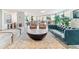 Beautifully furnished living room with a large round coffee table and comfortable seating arrangements at 1085 N Lafayette St # 702, Denver, CO 80218