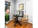 Charming seating area featuring a black round table, wood chairs, and hardwood floors at 1160 Birch St # 22, Denver, CO 80220