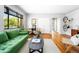 Well-lit living room featuring hardwood floors, an area rug, and an open floor plan at 1160 Birch St # 22, Denver, CO 80220