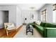 Inviting living room with hardwood floors, modern decor, and views into the kitchen at 1160 Birch St # 22, Denver, CO 80220