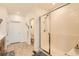 Bright bathroom showcases a tiled shower and access to a toilet room and vanity area at 3492 N Buchanan Way, Aurora, CO 80019