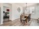 Bright dining area with stylish decor, a decorative rug, and abundant natural light at 3492 N Buchanan Way, Aurora, CO 80019