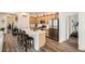 Well-equipped kitchen with stainless steel appliances, quartz countertops, and custom cabinetry at 3492 N Buchanan Way, Aurora, CO 80019