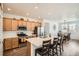 Modern kitchen with stainless steel appliances, a central island, and a breakfast bar at 3492 N Buchanan Way, Aurora, CO 80019