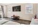 Bright living room featuring wood floors, large windows, and contemporary decor at 3492 N Buchanan Way, Aurora, CO 80019