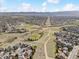 Expansive aerial view showcasing the neighborhood, local parks, and community layout at 684 Poppy Pl, Highlands Ranch, CO 80129