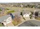 Beautiful aerial view of the home and its surrounding neighborhood, showcasing green spaces at 684 Poppy Pl, Highlands Ranch, CO 80129