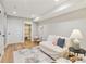 Finished basement space with luxury vinyl plank flooring and bonus seating area at 684 Poppy Pl, Highlands Ranch, CO 80129