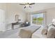 Bright bedroom features a sliding glass door, a side table, a makeup table and soft carpet at 684 Poppy Pl, Highlands Ranch, CO 80129