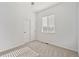 A bedroom features soft neutral carpet and a large window covered by blinds at 684 Poppy Pl, Highlands Ranch, CO 80129