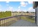 A deck offers a view of a backyard with well-maintained shrubs and a green field at 684 Poppy Pl, Highlands Ranch, CO 80129