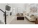 Spacious living room featuring a fireplace, neutral furnishings, and large windows for ample light at 684 Poppy Pl, Highlands Ranch, CO 80129