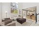Bright, open living space connected to the dining area, featuring neutral tones and modern design at 684 Poppy Pl, Highlands Ranch, CO 80129