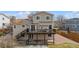 Two-story home featuring a large deck with stairs leading to a spacious backyard at 10885 Longs Peak Ln, Parker, CO 80138
