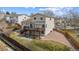 Aerial view of a backyard with a large deck, patio, and fenced-in yard at 10885 Longs Peak Ln, Parker, CO 80138