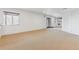 Spacious basement featuring neutral carpeting, a sliding glass door, and ample natural light at 10885 Longs Peak Ln, Parker, CO 80138