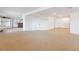 Spacious finished basement with neutral carpet, white walls, and a built-in bar area at 10885 Longs Peak Ln, Parker, CO 80138