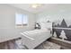 Charming bedroom with a painted accent wall, plush rug, and ample natural light at 10885 Longs Peak Ln, Parker, CO 80138