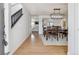 Stylish dining room boasts hardwood floors, modern lighting, and an open layout at 10885 Longs Peak Ln, Parker, CO 80138