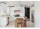 Bright kitchen features white cabinets, a large island, stainless steel appliances, and modern finishes at 10885 Longs Peak Ln, Parker, CO 80138