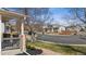 Neighborhood street view with well-kept lawns and sidewalks at 10885 Longs Peak Ln, Parker, CO 80138