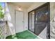 Enclosed balcony with a sliding door and green carpet at 7770 W 38Th Ave # 207, Wheat Ridge, CO 80033